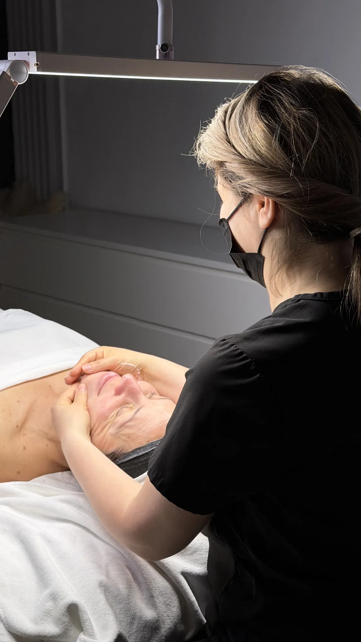 Professional facial care during a DMK treatment appointment