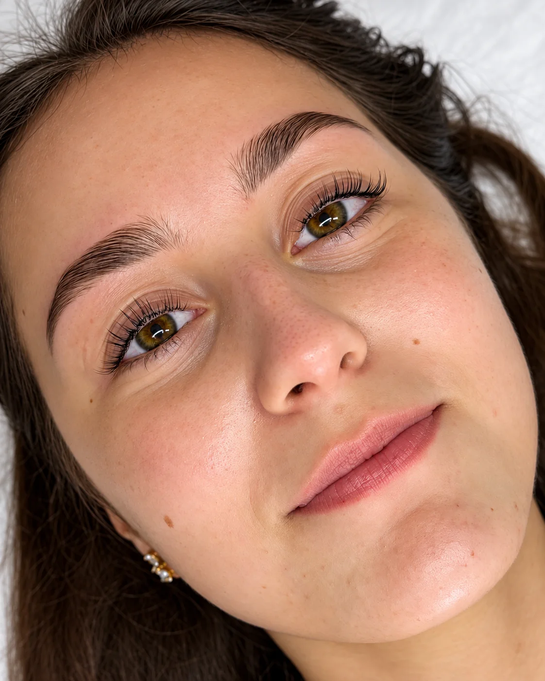 Close-up of lifted lashes and shaped brows